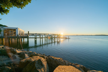 Sunrise  glows across harbor