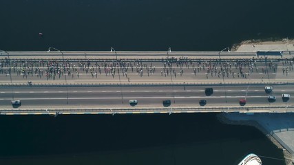 Marathon running on the bridge. Top view