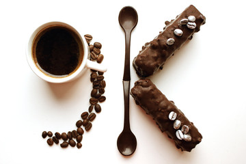 Coffee cup with desserts, chocolate spoons and coffee beans formin 9K, sepia tones