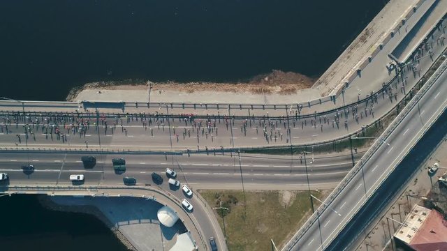 Marathon running on the bridge. Top view