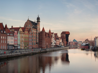 Fototapeta na wymiar Old town of Gdansk in the early morning: an embankment and famous crane Zurav. High resolution panorama.