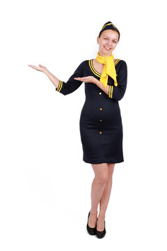 Stewardesse - Charming and smiling Stewardess Dressed In Blue Uniform Holding In Hand. Isolated on white backgroundv