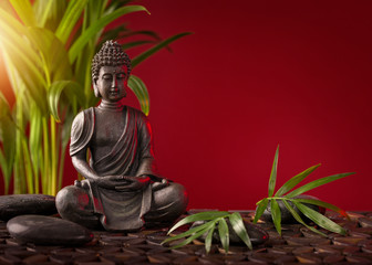 Buddha statue  on a red background