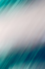 Abstract background in blue and green tones, blurred motion of light and stripes moving fast, rays in water effect, vertical image