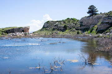 Fototapeta na wymiar View of a lake and rocks at spring