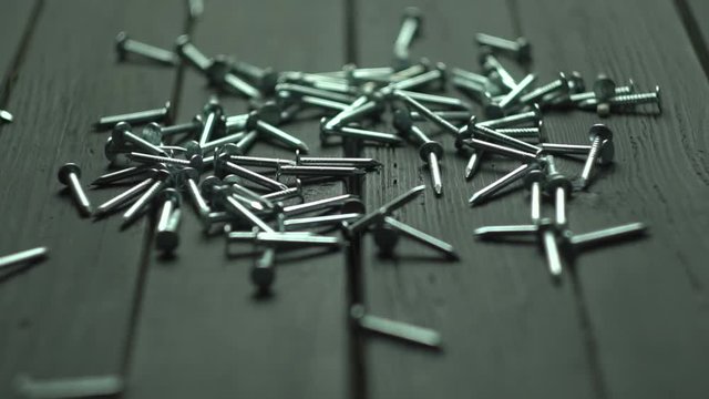 Nails Falling On The Black Table Slow Motion