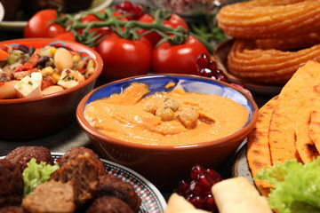 Middle eastern or arabic dishes and assorted meze, concrete rustic background. Falafel. Turkish Dessert Baklava with pistachio. Halal food. Lebanese cuisine