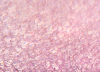 Fototapeta premium Pink background of shining drops of water