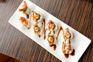 shrimp rolls. rolls on a white plate