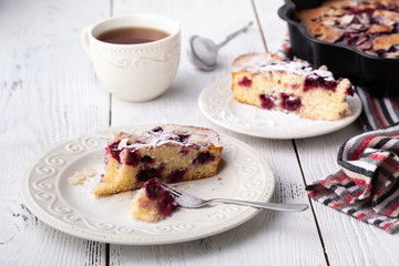 Breakfast concept, Homemade slice of shortbread dough raspberry pie with almond petals