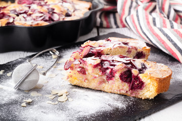 Breakfast concept, Homemade slice of shortbread dough raspberry pie with almond petals