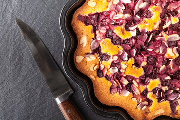Breakfast concept, Homemade slice of shortbread dough raspberry pie with almond petals