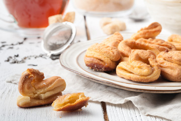Homemade buns stuffed with cottage cheese on a wooden background