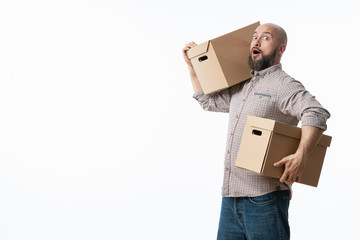 Portrait of a handsome young man holding card boxes, isolated on white