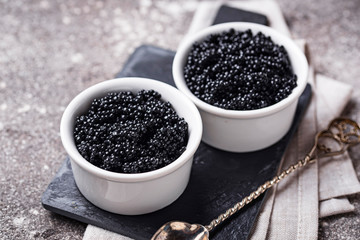 Fototapeta na wymiar Sturgeon black caviar in bowls