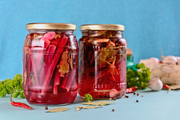 home canning, jars with pickled beet tops for harvesting for the winter