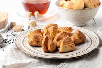Homemade buns stuffed with cottage cheese on a wooden background