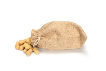 Peanuts. Jute burlap bag full of whole peanuts, isolated on white background.