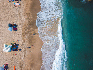 Fototapeta na wymiar Beach with sun loungers on the coast of the ocean