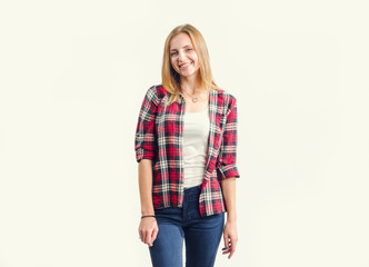 Beautiful happy young woman standing on a light background, photo toning.