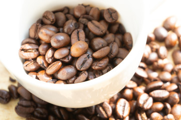coffee beans in a white mug