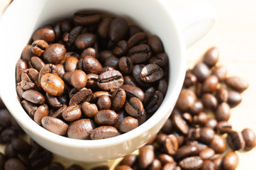 coffee beans in a white mug
