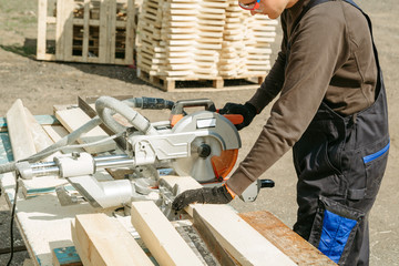 Work sawing boards. Sawmill. wood harvesting process