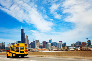 School bus on road over Chicago city Illinois, USA