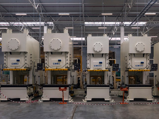 Machines for the production of metal automotive parts