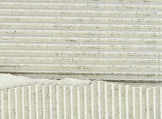 Cardboard texture. cardboard background . Piece of corrugated cardboard torn. Cardboard texture ragged edge. Space for text.