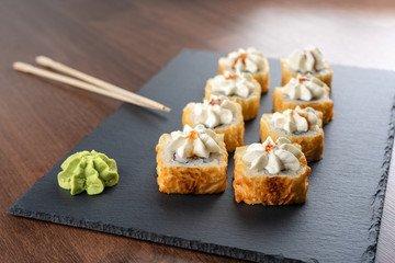 Baked rolls with a hat on a slate Board