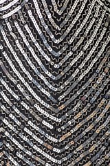 Fabric with sequins and sequins of bright colors. Fashion glitter fabric, sequins. Shiny surface