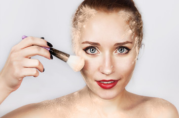 Woman Beauty Face Cosmetics. Portrait Of Sexy Young Female Model Applying Makeup, Loose Blush With Brush On Facial Skin.
