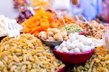 Traditional spices, dry fruits and nuts in local spicy bazaar in New Delhi, India