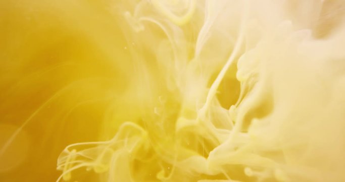 Yellow Paint. Threads And Drops Mixing In Water. Ink Swirling.