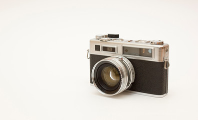 Old classic film photo camera on white background isolated with free space