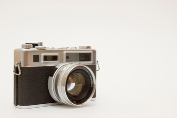 Fototapeta premium Old classic film photo camera on white background isolated with free space