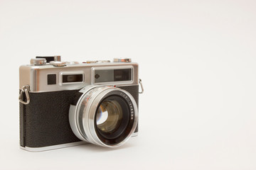 Old classic film photo camera on white background isolated with free space