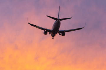 orange sunset plane landing