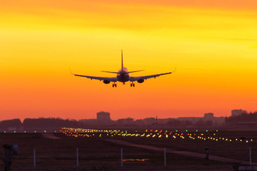 Fototapeta na wymiar sunset plane landing lights papi