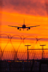 Fototapeta na wymiar sunset plane landing freedom