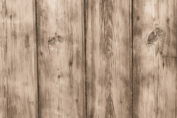 The rough wooden surface of table. Dirty and shabby wooden boards. Old wood plank texture background. Light brown wooden fence, panel.