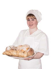 woman baker holds a dish with sweet buns isolated