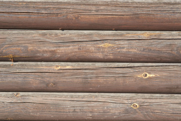 Timber logs. Wall of traditional hardwood timber house.