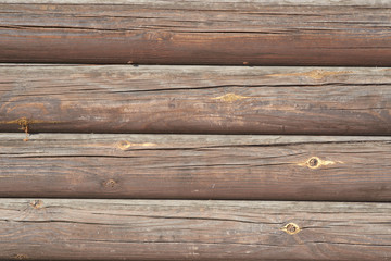 Naklejka premium Timber logs. Wall of traditional hardwood timber house.
