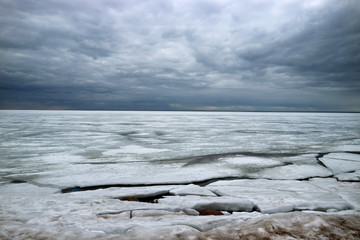 Ice and sky in the clouds in winter the Gulf of Finland coast as a background.