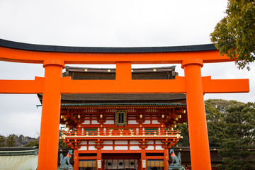 Orange gates and objects at Fushimi Inari-Taisha Shrine in Kyoto, Japan
