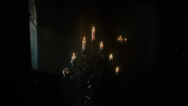 Candles are burning creating a vibrant atmosphere of emptiness