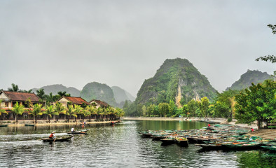 Fototapeta na wymiar Rowboats in Tam Coc town, the Ninh Binh Province of Vietnam