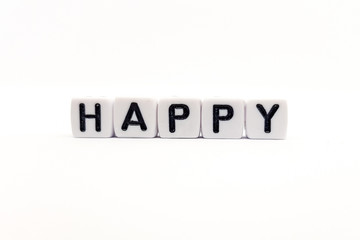 happy word built with white cubes and black letters on white background